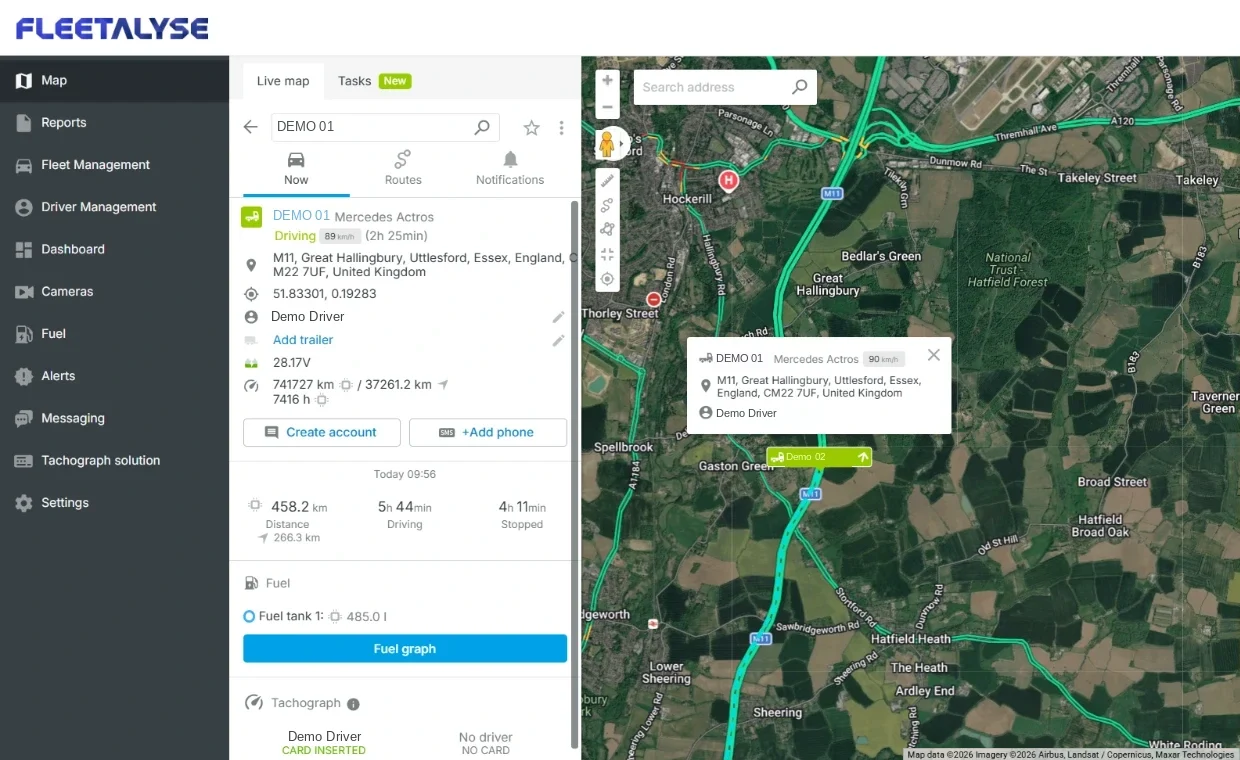 The Fleetalyse live map with a Mercedes Actros selected: its speed, position on the M11 in Essex, driver, mileage and tachograph status in the side panel, and the lorry and a second vehicle on the satellite map.